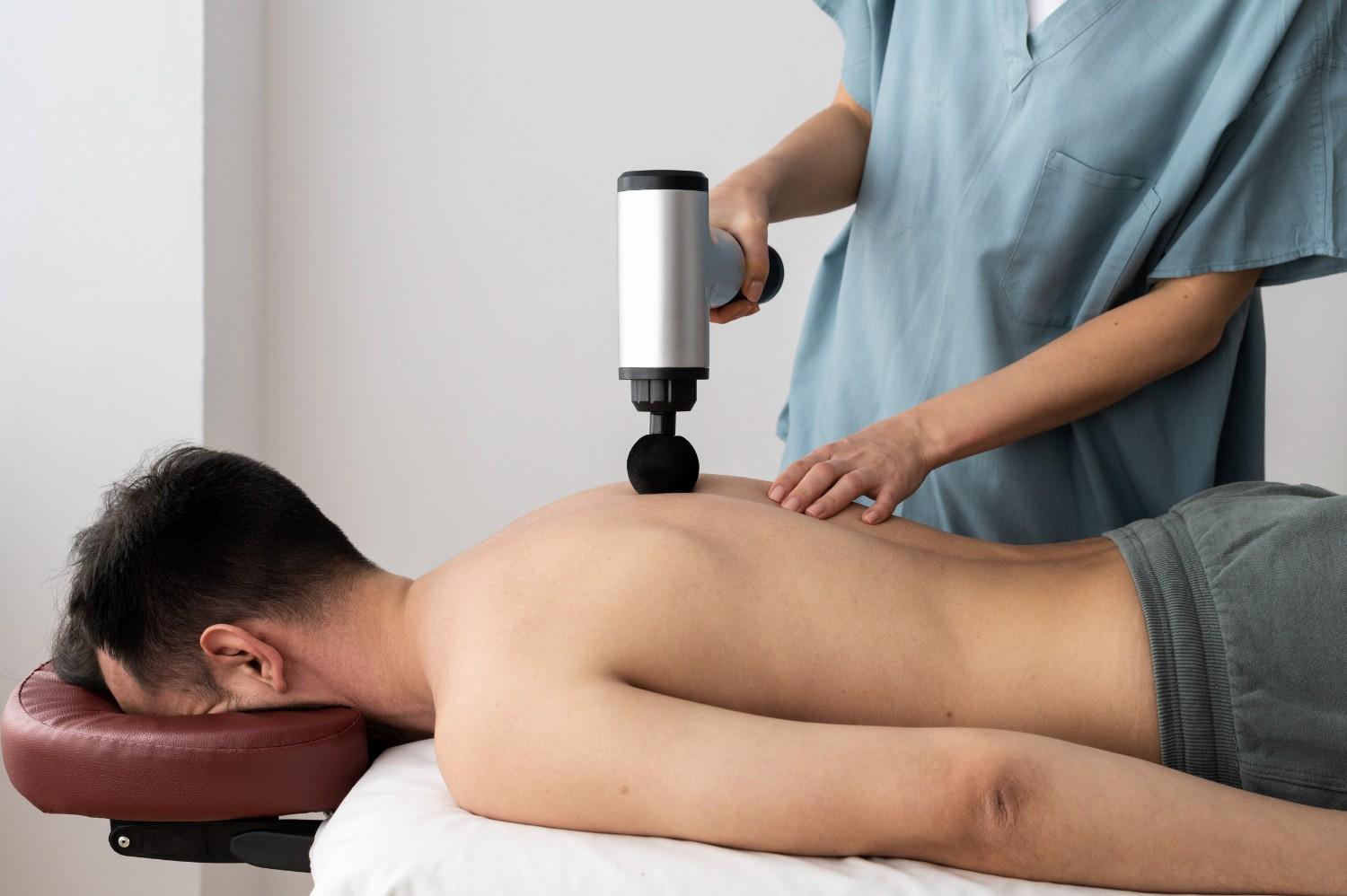 person-using-massage-gun (1)
